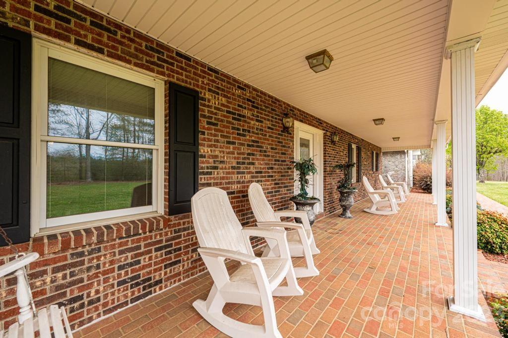 3808 Grace Chapel Road Granite Falls, NC 28630 - Photo 4 of 48 a view of a chairs and table in the balcony