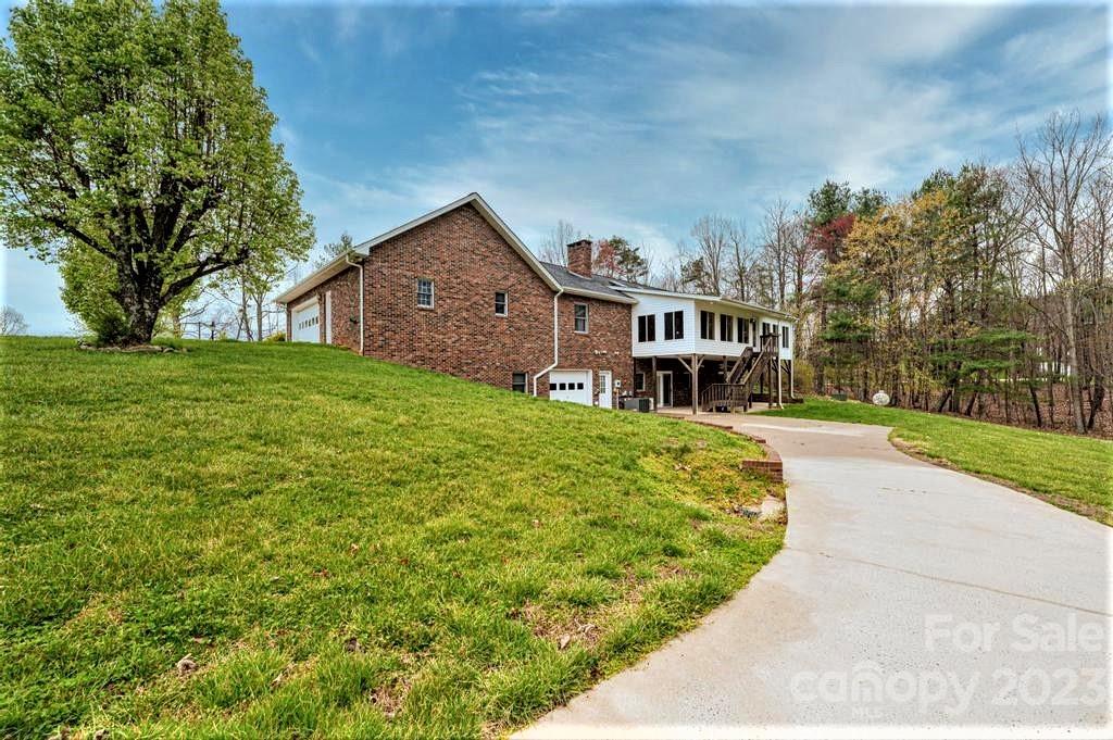 3808 Grace Chapel Road Granite Falls, NC 28630 - Photo 42 of 48 a front view of a house with yard and green space
