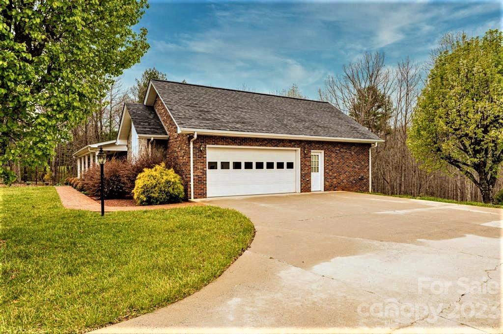 3808 Grace Chapel Road Granite Falls, NC 28630 - Photo 43 of 48 a view of a house with a yard