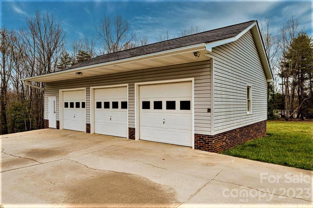 3808 Grace Chapel Road Granite Falls, NC 28630 - Photo 44 of 48 a view of white house with a yard