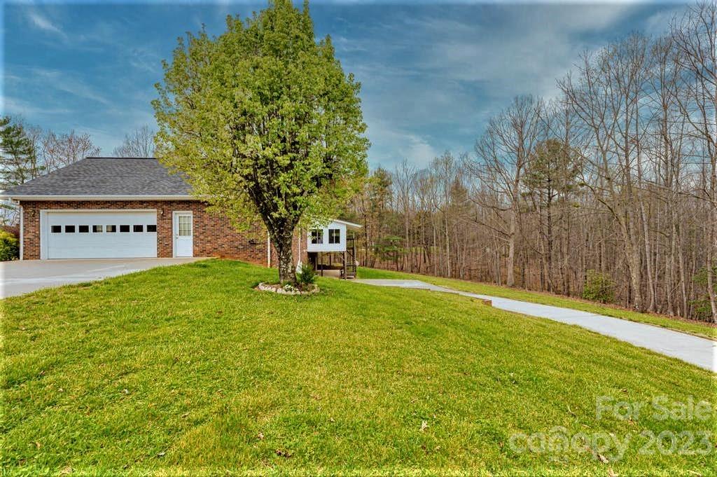 3808 Grace Chapel Road Granite Falls, NC 28630 - Photo 45 of 48 a view of a house with a yard