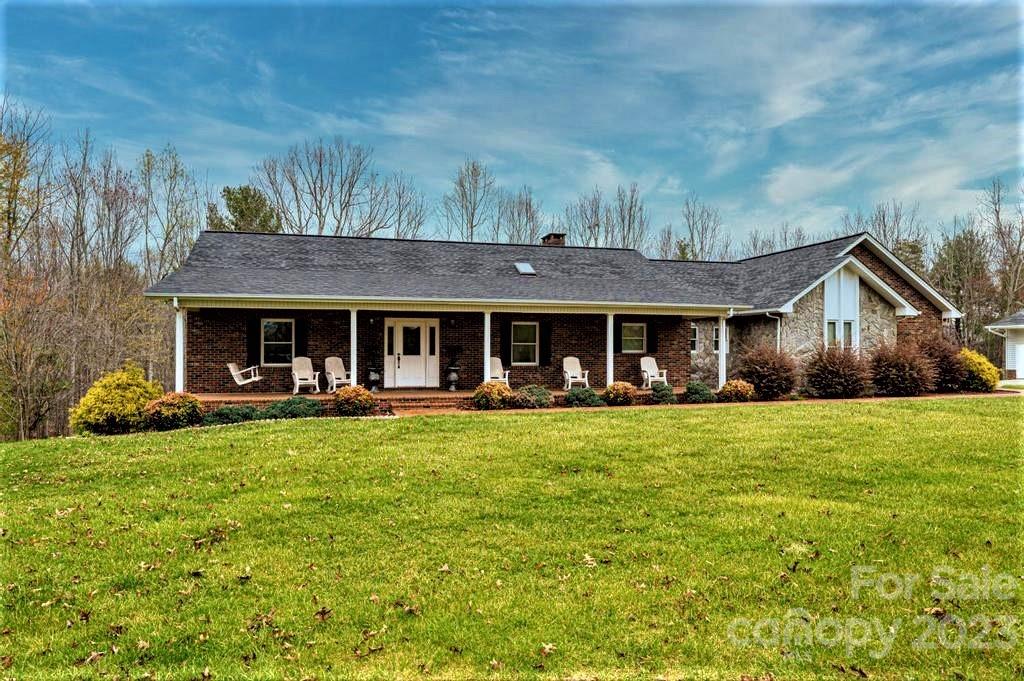 3808 Grace Chapel Road Granite Falls, NC 28630 - Photo 48 of 48 a front view of a house with swimming pool and porch with furniture