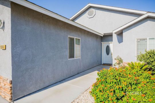 1516 South Farragut Street Ridgecrest, CA 93555 - Photo 4 of 24 a front view of a house with garden