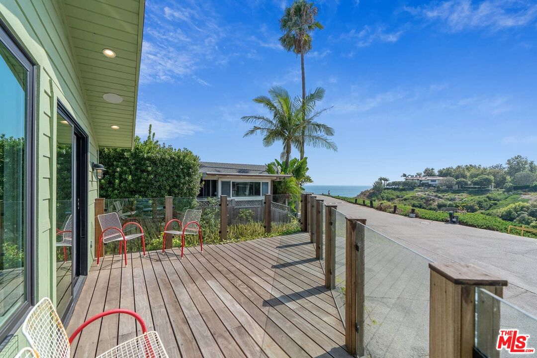 249 Paradise Cove Road Malibu, CA 90265 - Photo 4 of 41 a view of a house with backyard and a tree