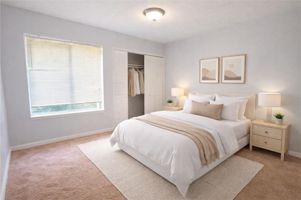 3575 Oakvale Road, Unit 420 Decatur, GA 30034 - Photo 11 of 16 a bedroom with a bed and a window