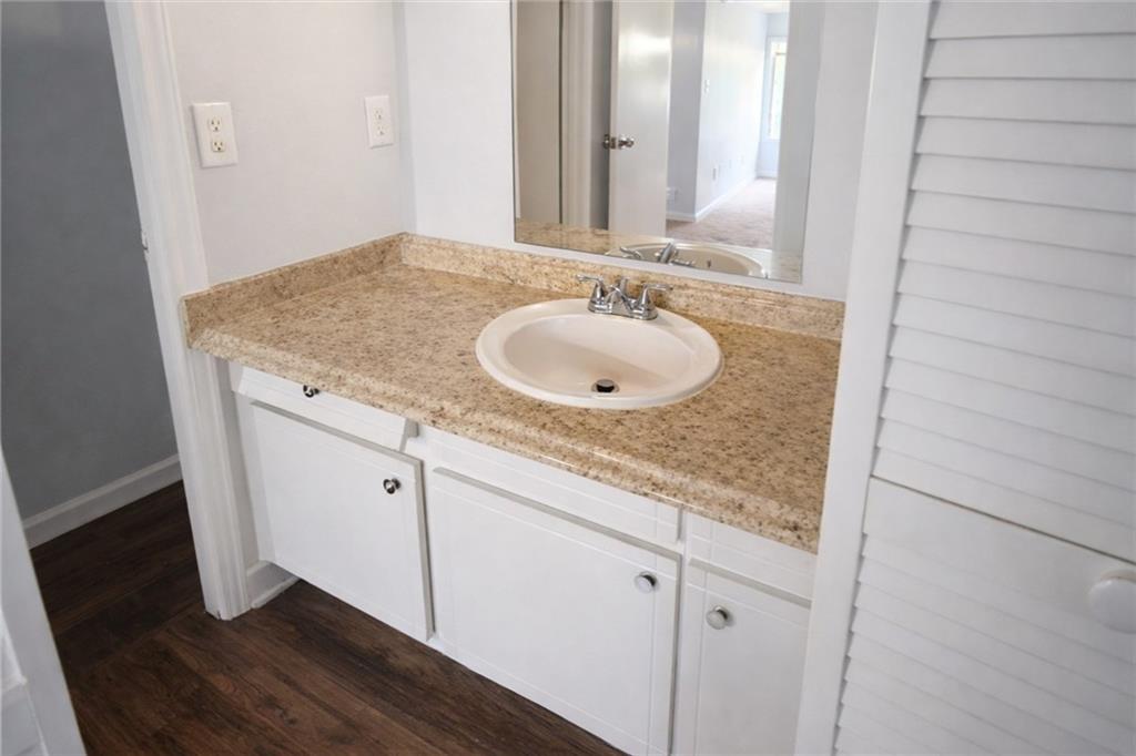 3575 Oakvale Road, Unit 420 Decatur, GA 30034 - Photo 13 of 16 a bathroom with a granite countertop sink and a mirror
