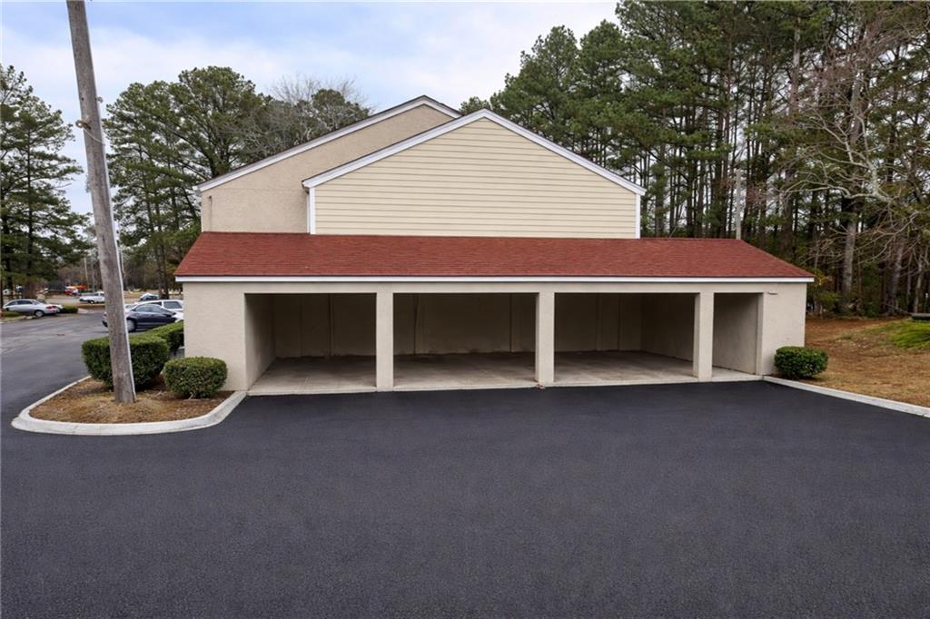 3575 Oakvale Road, Unit 420 Decatur, GA 30034 - Photo 2 of 16 a view of a house with a yard and garage