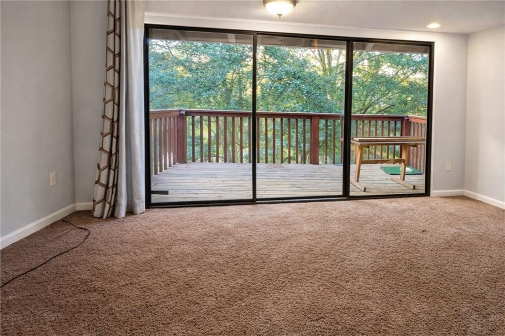 3575 Oakvale Road, Unit 420 Decatur, GA 30034 - Photo 3 of 16 a view of empty room with floor to ceiling window