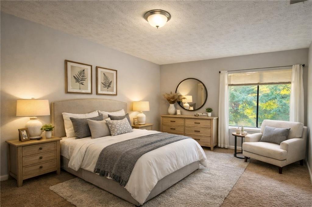 3575 Oakvale Road, Unit 420 Decatur, GA 30034 - Photo 8 of 16 a bedroom with a bed and a couch