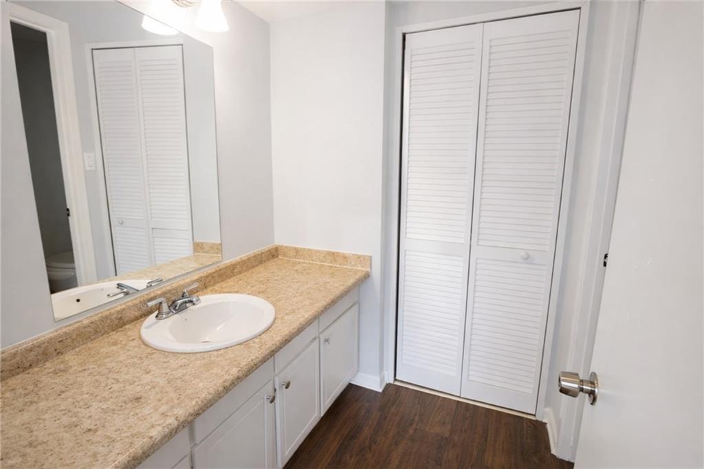 3575 Oakvale Road, Unit 420 Decatur, GA 30034 - Photo 9 of 16 a bathroom with a granite countertop sink and a mirror