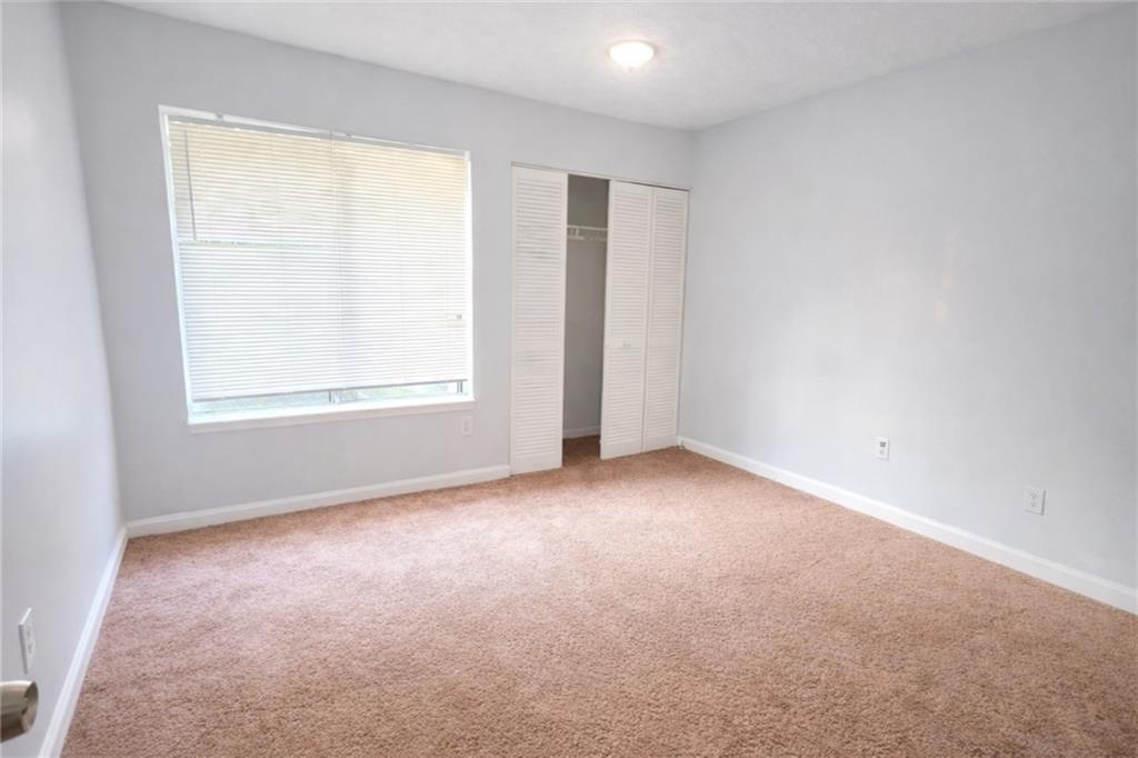 3575 Oakvale Road, Unit 420 Decatur, GA 30034 - Photo 10 of 16 an empty room with a window