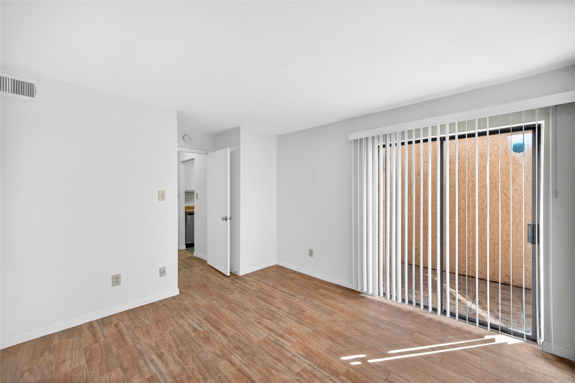 5000 Milwee Street, Unit 61 Houston, TX 77092 - Photo 16 of 42 a view of a room with wooden floor and a window