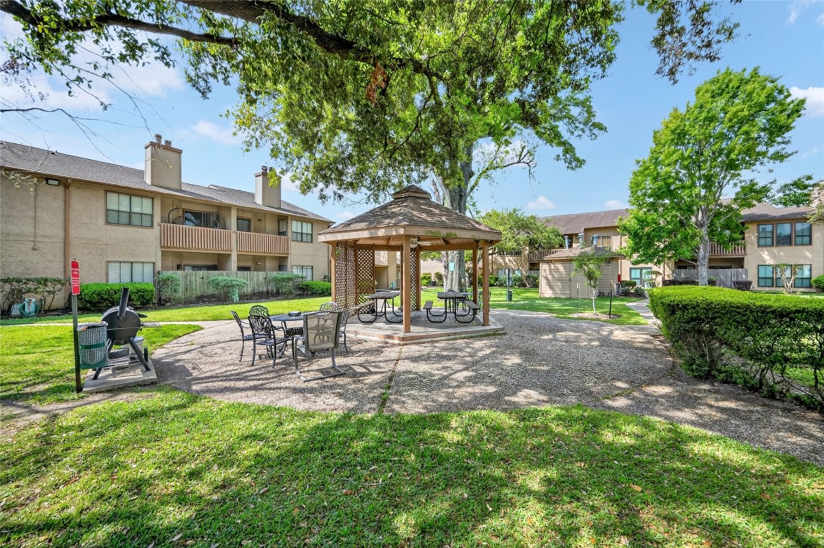 5000 Milwee Street, Unit 61 Houston, TX 77092 - Photo 40 of 42 a view of a chair and table in backyard of the house