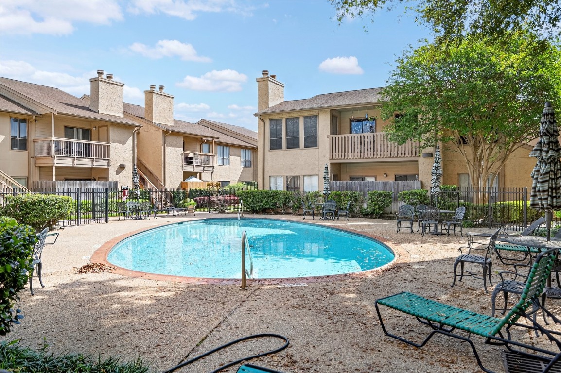 5000 Milwee Street, Unit 61 Houston, TX 77092 - Photo 7 of 42 a swimming pool with outdoor seating and yard