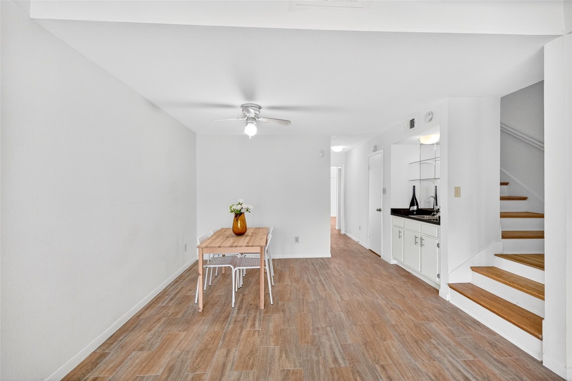 5000 Milwee Street, Unit 61 Houston, TX 77092 - Photo 10 of 42 a living room with furniture and a wooden floor