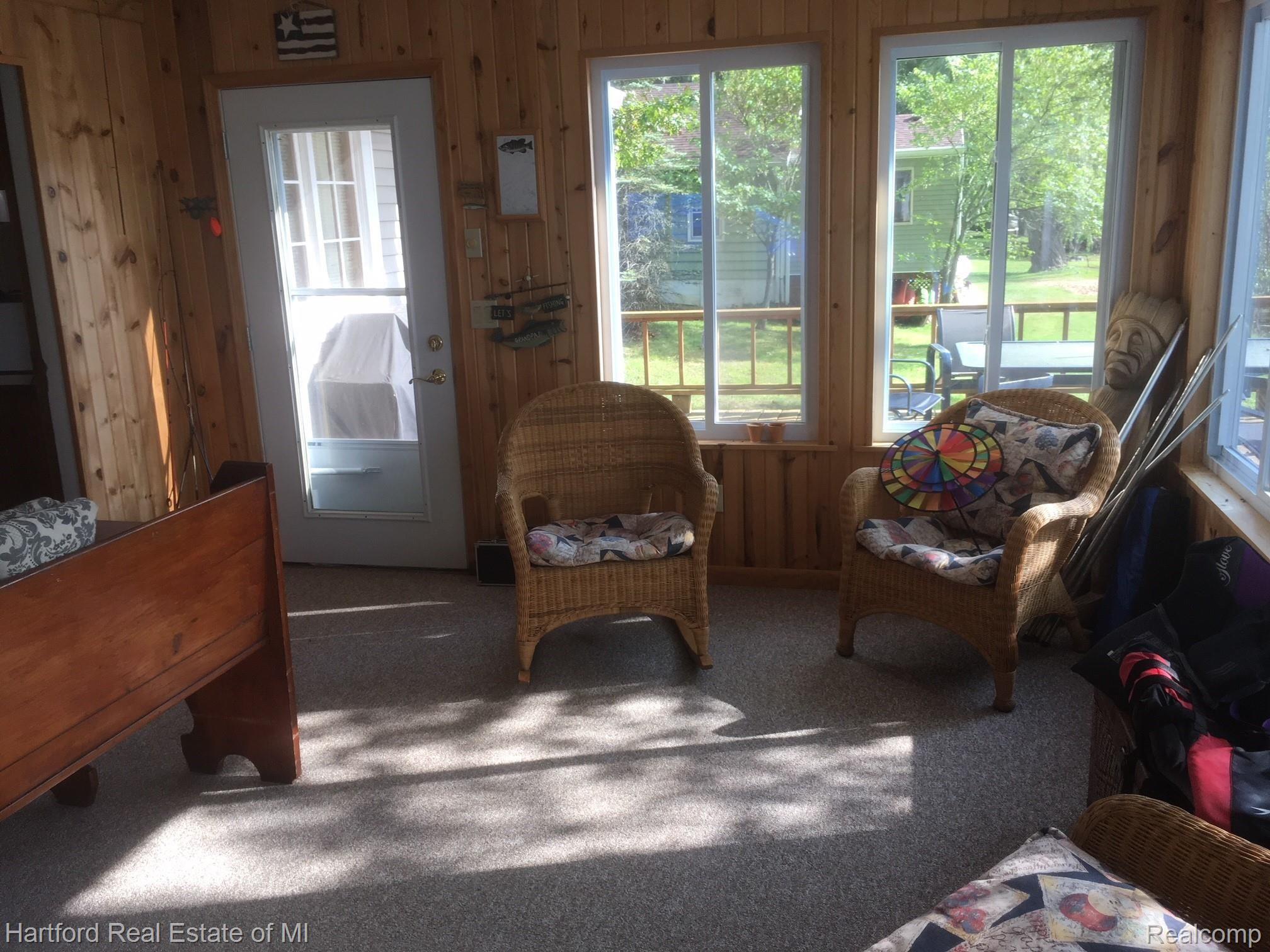 7350 Maday Road Pinckney, MI 48169 - Photo 10 of 20 Family room leads out to deck.