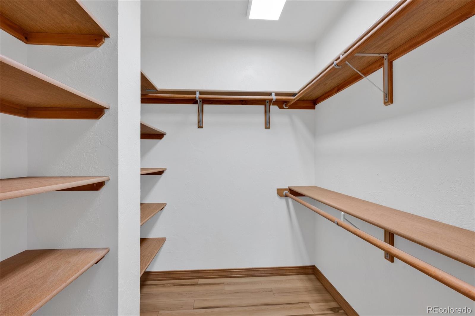 820 Schulze Ranch Road Westcliffe, CO 81252 - Photo 15 of 39 a view of walk in closet with empty racks