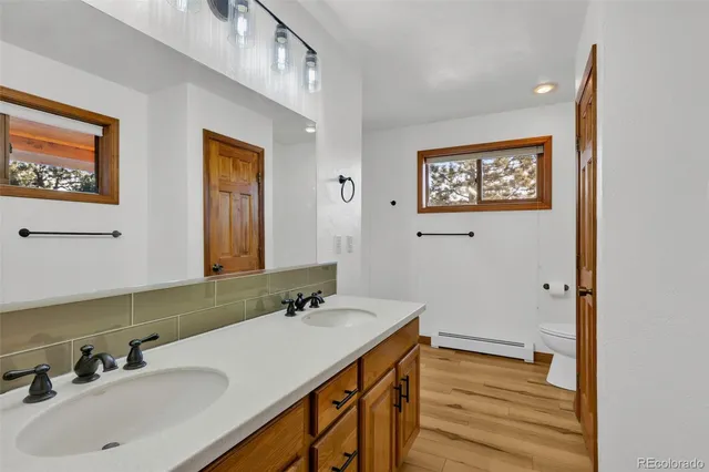 a bathroom with a sink a mirror and a bathtub