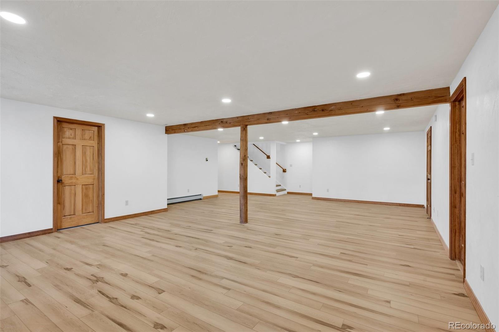 820 Schulze Ranch Road Westcliffe, CO 81252 - Photo 23 of 39 a view of empty room with wooden floor