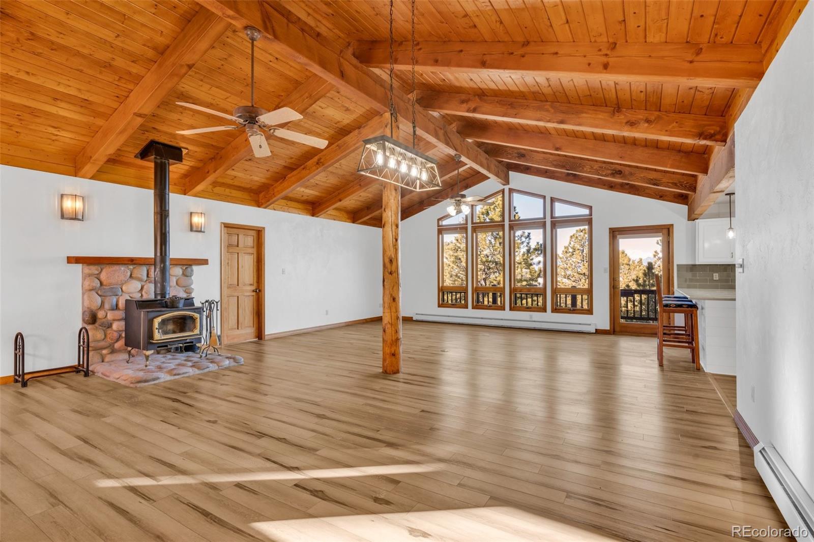 820 Schulze Ranch Road Westcliffe, CO 81252 - Photo 7 of 39 a view of a hall with wooden floor