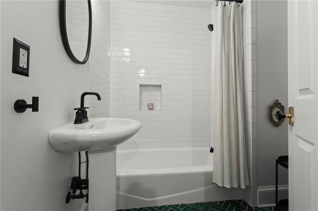 1788 Moores Mill Road Northwest Atlanta, GA 30318 - Photo 12 of 25 a bathroom with a sink