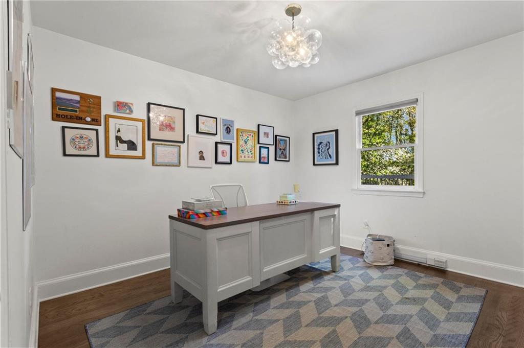 1788 Moores Mill Road Northwest Atlanta, GA 30318 - Photo 14 of 25 a view of a workspace with furniture and window