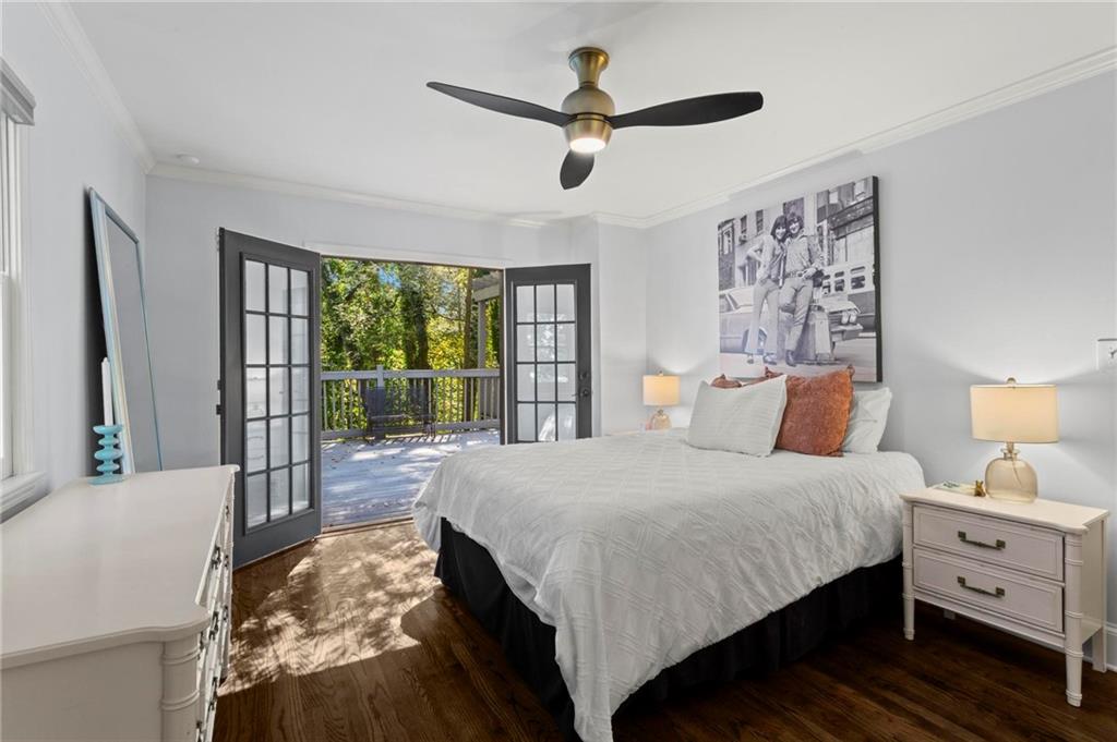 1788 Moores Mill Road Northwest Atlanta, GA 30318 - Photo 15 of 25 a bedroom with a large bed and a window