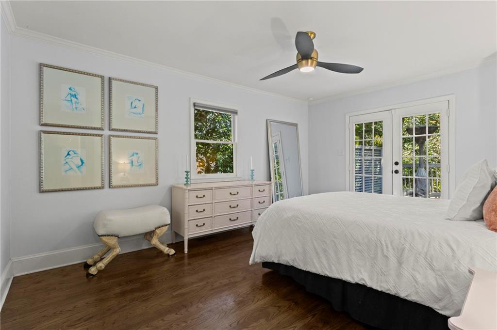 1788 Moores Mill Road Northwest Atlanta, GA 30318 - Photo 16 of 25 a bedroom with a bed and a window