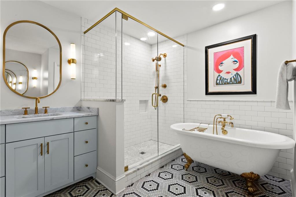 1788 Moores Mill Road Northwest Atlanta, GA 30318 - Photo 18 of 25 a bathroom with a sink and a mirror