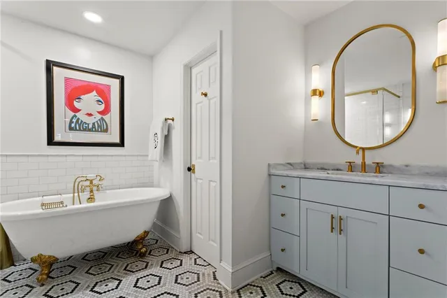 a bathroom with a sink and mirror