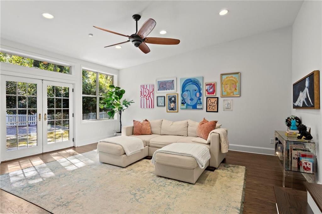1788 Moores Mill Road Northwest Atlanta, GA 30318 - Photo 2 of 25 a living room with furniture and a large window