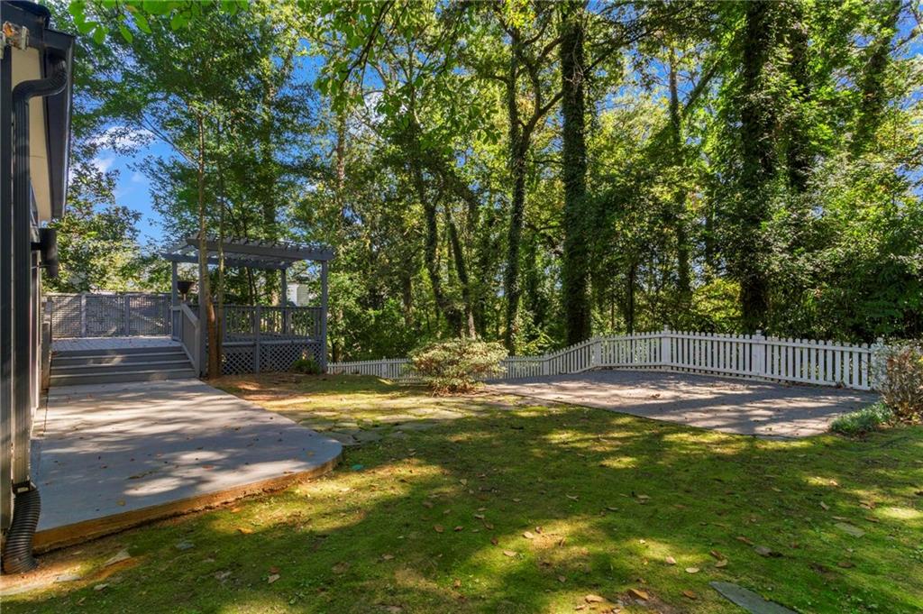 1788 Moores Mill Road Northwest Atlanta, GA 30318 - Photo 25 of 25 a view of a yard with a tree