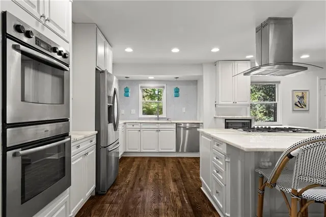 a kitchen with a sink stove and refrigerator