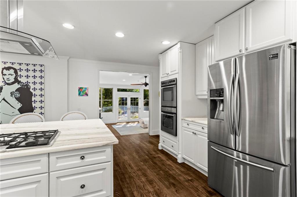 1788 Moores Mill Road Northwest Atlanta, GA 30318 - Photo 6 of 25 a kitchen with stainless steel appliances a refrigerator stove and sink