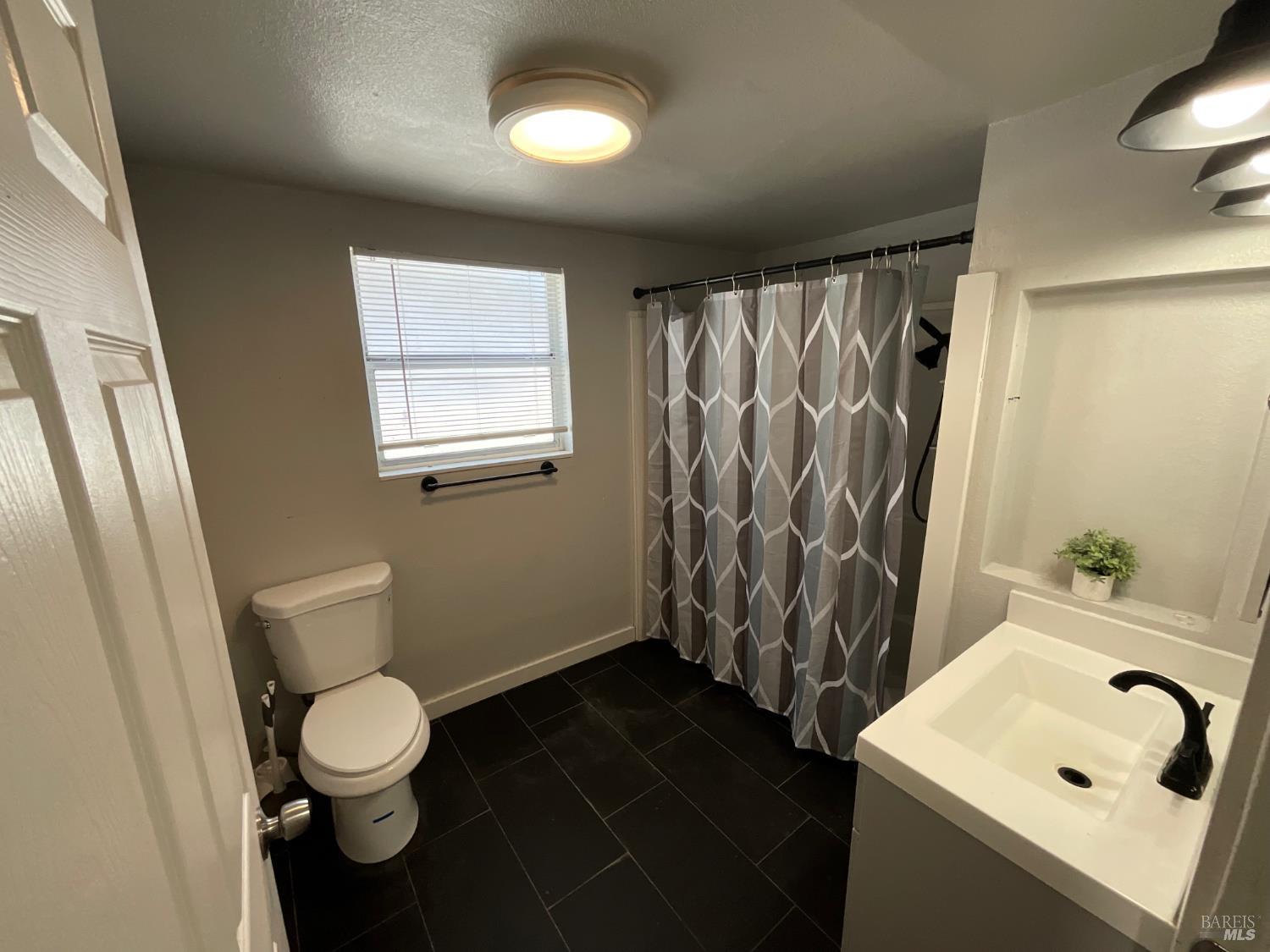 138 West 6th Street Santa Rosa, CA 95401 - Photo 19 of 31 The bathroom has been updated with modern finishes.
