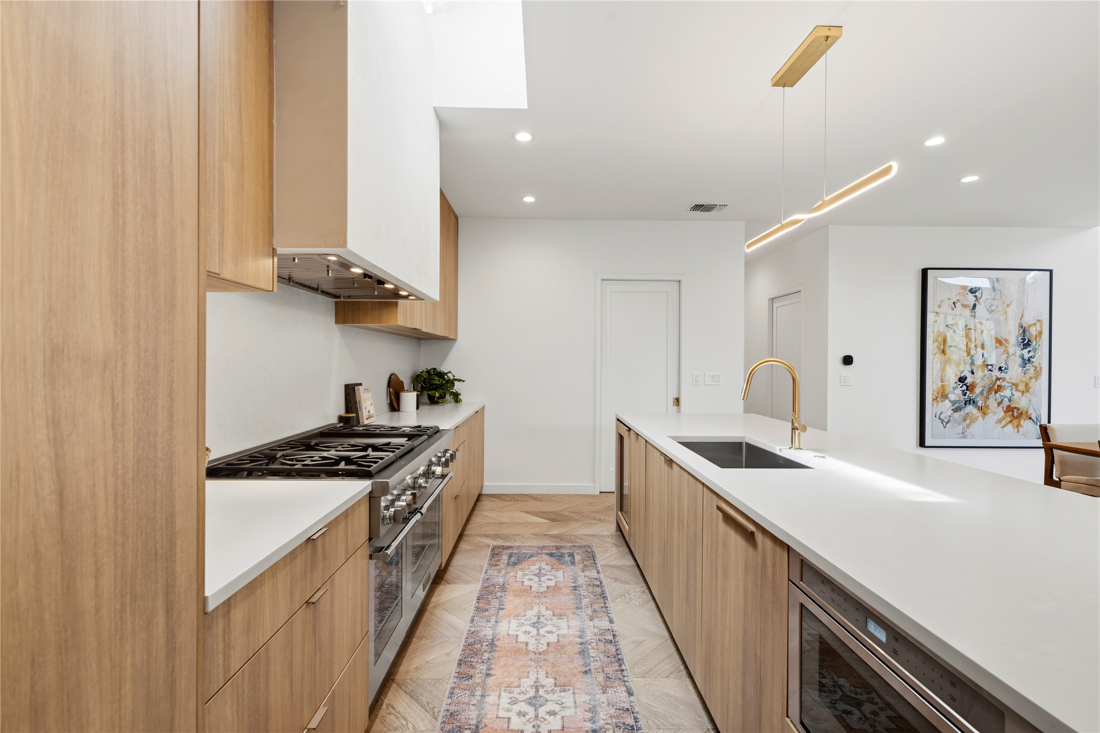 2306 South 2nd Street Austin, TX 78704 - Photo 10 of 36 White oak cabinetry and stainless steel appliances