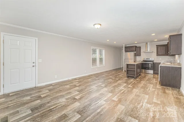 a view of kitchen with wooden floor