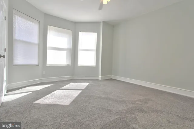 an empty room with closet area
