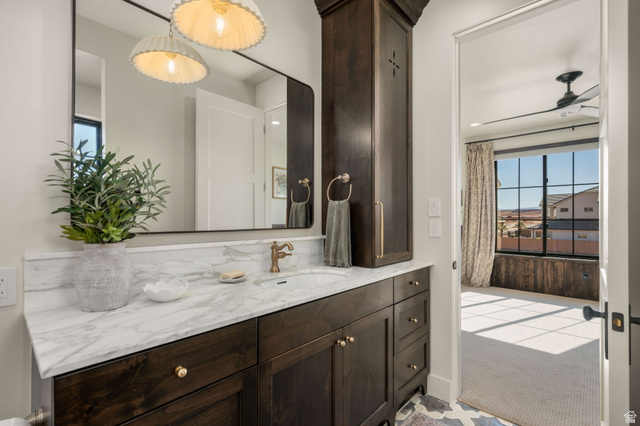 4871 South Homestead Way Washington, UT 84780 - Photo 75 of 151 Bathroom featuring vanity, healthy amount of natural light, a ceiling fan, and light colored carpet