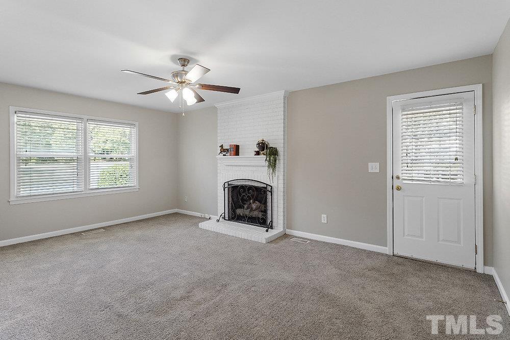 3304 Blue Ridge Road Raleigh, NC 27612 - Photo 13 of 34 a view of an empty room with window and fireplace