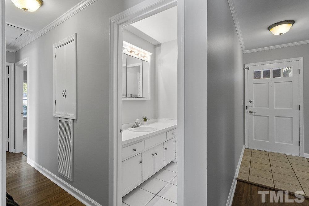 3304 Blue Ridge Road Raleigh, NC 27612 - Photo 17 of 34 a view of bathroom with dual sinks