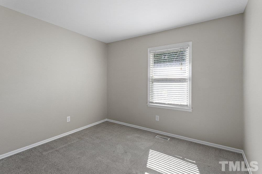 3304 Blue Ridge Road Raleigh, NC 27612 - Photo 18 of 34 an empty room with a window
