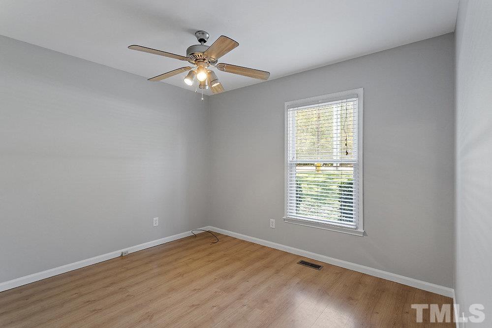 3304 Blue Ridge Road Raleigh, NC 27612 - Photo 22 of 34 a view of an empty room with a window