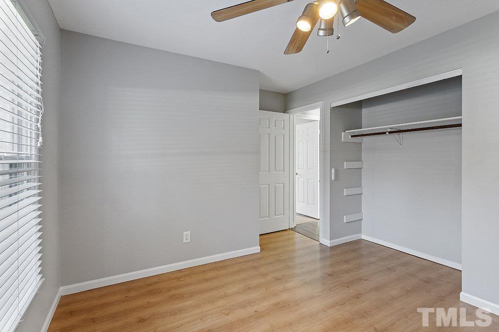 3304 Blue Ridge Road Raleigh, NC 27612 - Photo 23 of 34 an empty room with a empty space and chandelier fan