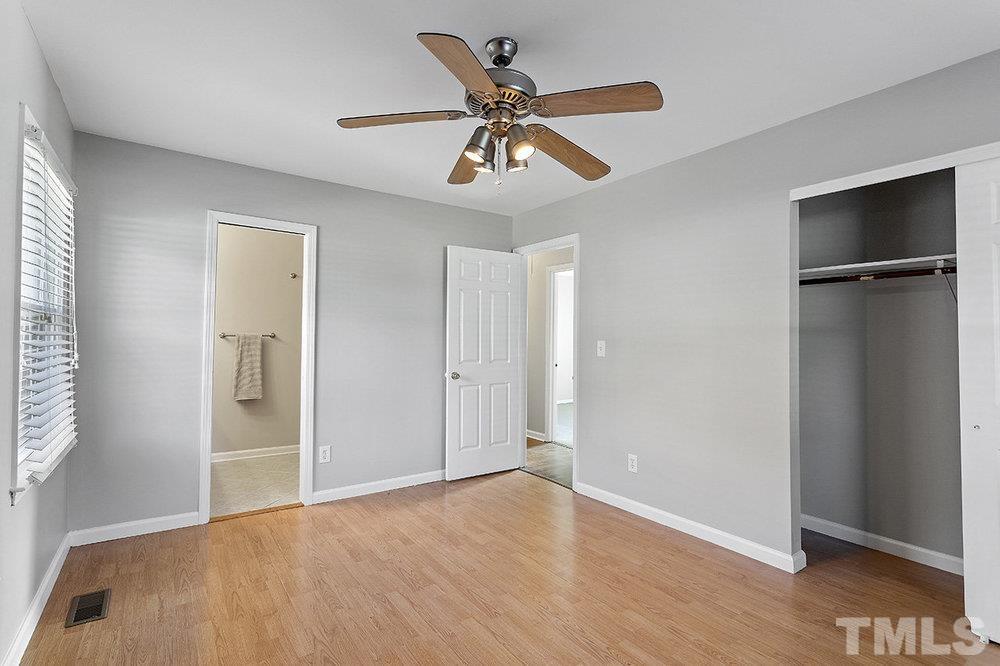 3304 Blue Ridge Road Raleigh, NC 27612 - Photo 25 of 34 a view of an empty room with wooden floor