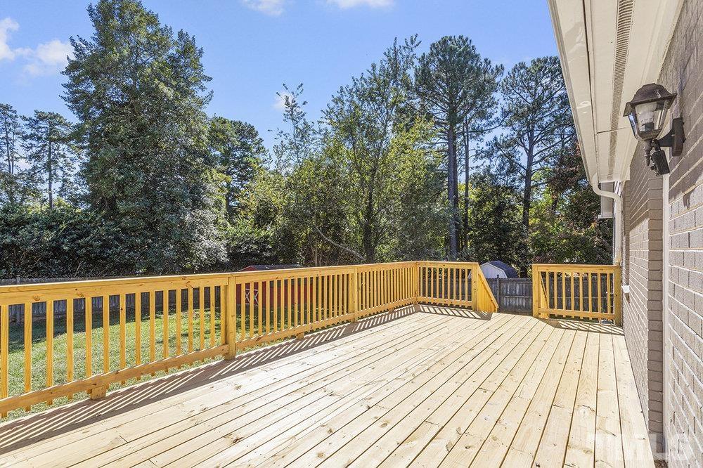 3304 Blue Ridge Road Raleigh, NC 27612 - Photo 29 of 34 a view of balcony with deck and wooden floor