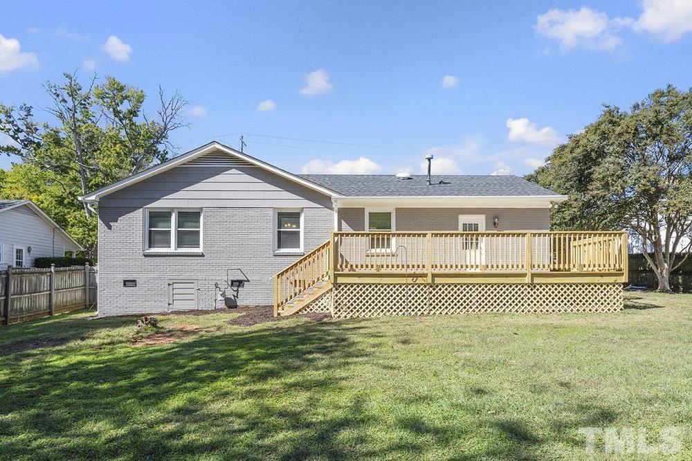 3304 Blue Ridge Road Raleigh, NC 27612 - Photo 32 of 34 a front view of a house with a yard