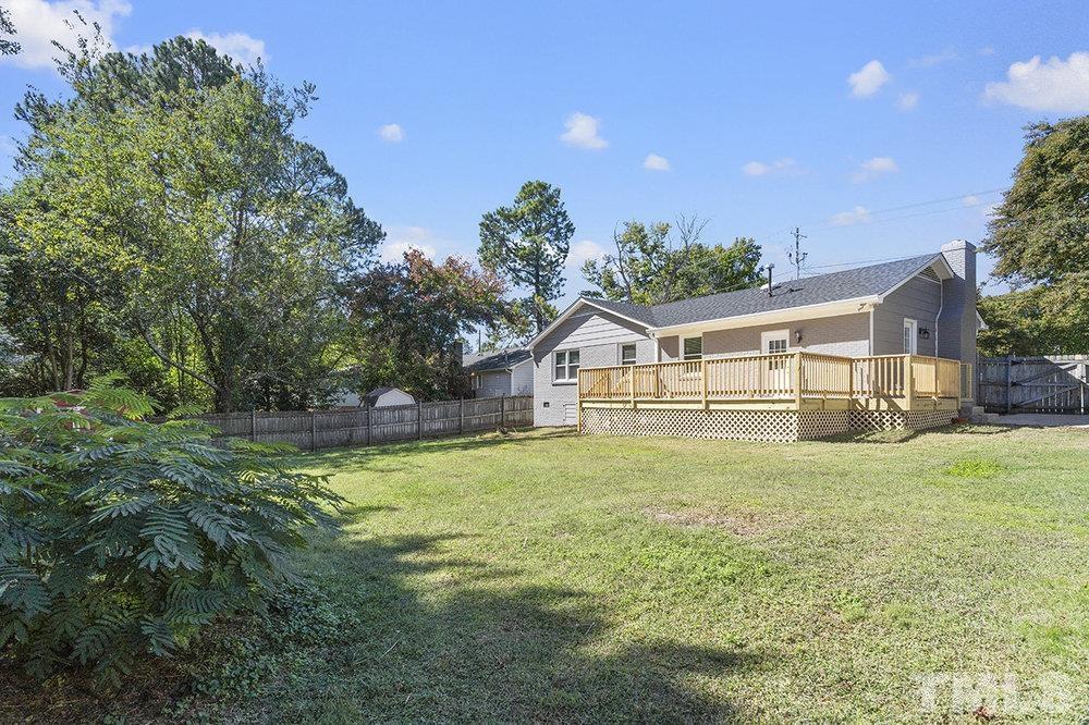 3304 Blue Ridge Road Raleigh, NC 27612 - Photo 33 of 34 a front view of house with yard and green space