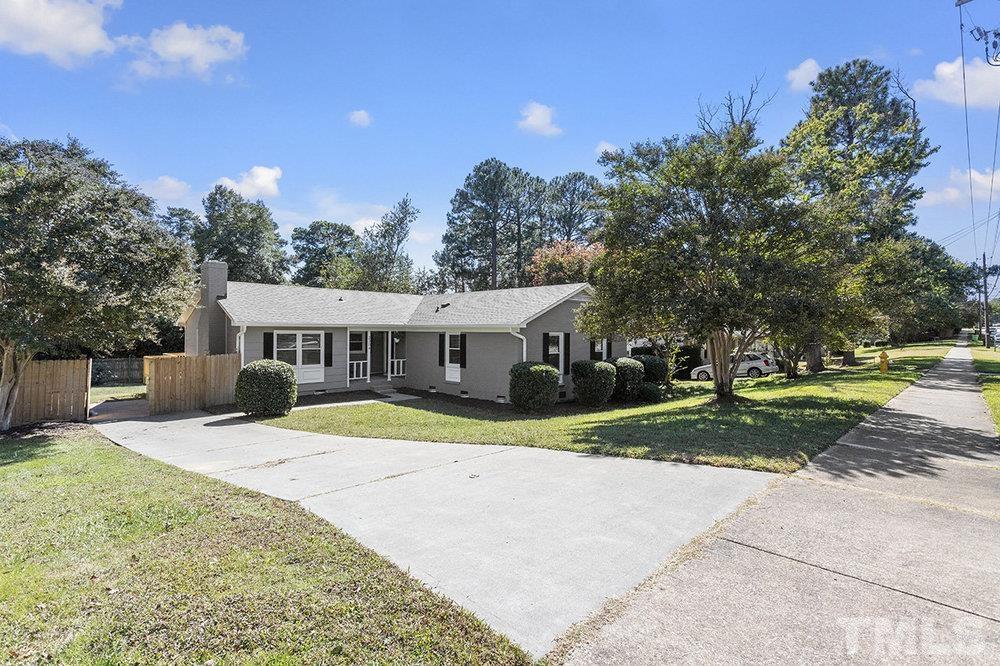 3304 Blue Ridge Road Raleigh, NC 27612 - Photo 34 of 34 a view of a house with a yard and large trees