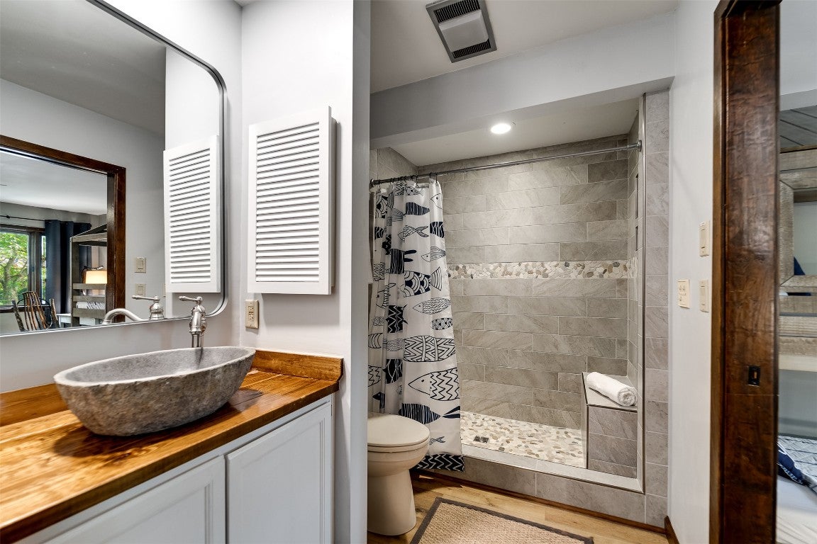 122 Emerald Ridge Road, Unit 45 Sapphire, NC 28774 - Photo 24 of 46 Main level bathroom with tile and stone shower